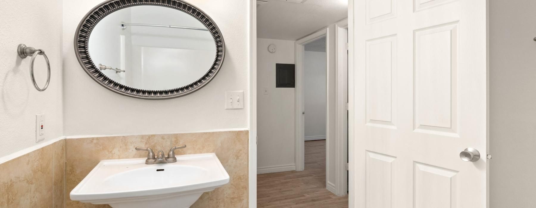a bathroom with a mirror and sink