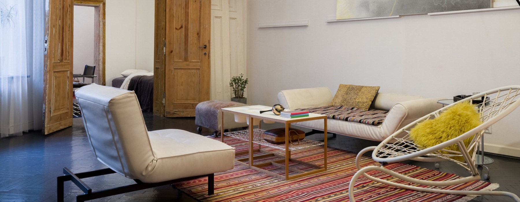 living room with a couch, chairs and coffee table